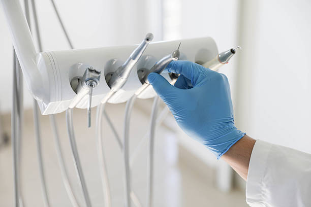 Professional Tooth Extraction technician working in Bibb County County, AL
